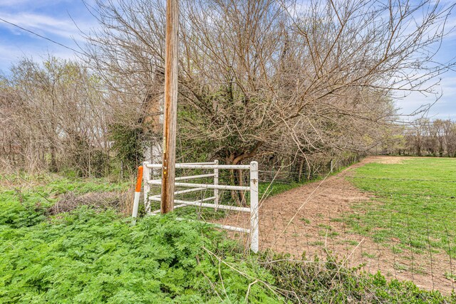view of gate featuring fence