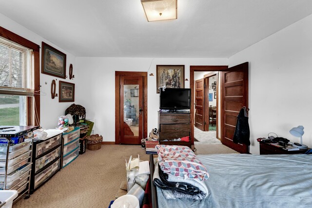 bedroom featuring baseboards and carpet flooring
