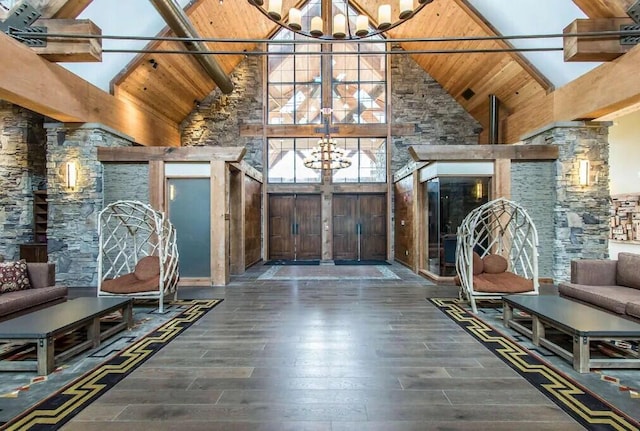 interior space with wooden ceiling, a notable chandelier, and wood finished floors