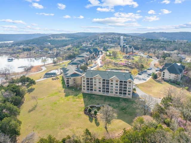 birds eye view of property with a water view