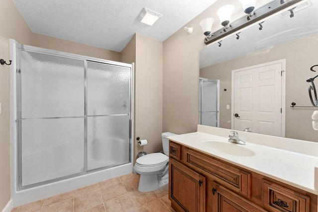 full bath with visible vents, toilet, tile patterned floors, vanity, and a stall shower