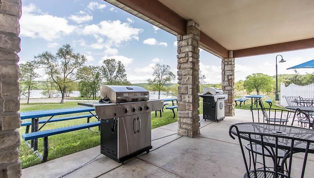 view of patio / terrace with a grill and outdoor dining space