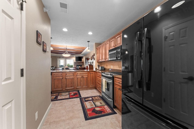 kitchen featuring recessed lighting, pendant lighting, visible vents, appliances with stainless steel finishes, and brown cabinets