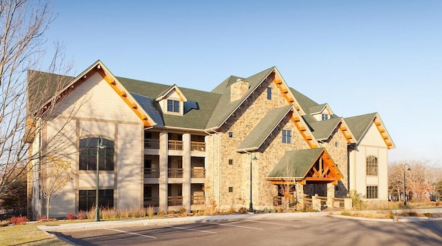 view of property featuring uncovered parking