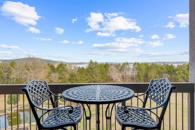 balcony with a forest view and a mountain view