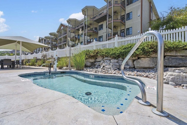 view of pool featuring fence private yard and a patio area