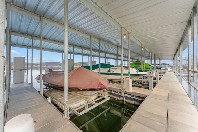 view of dock featuring a water view and boat lift