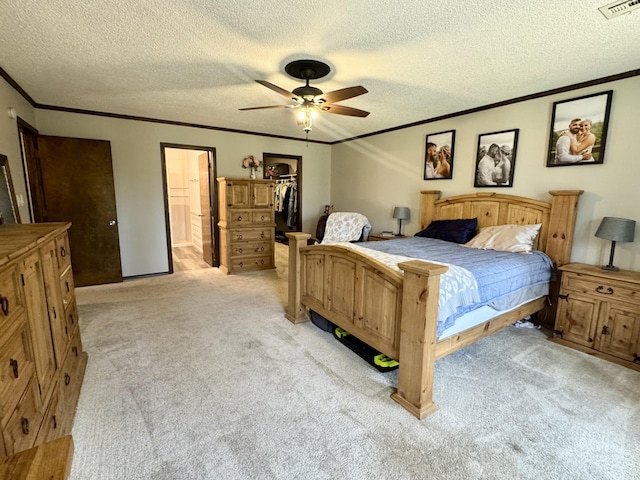 bedroom featuring light carpet, visible vents, and ornamental molding
