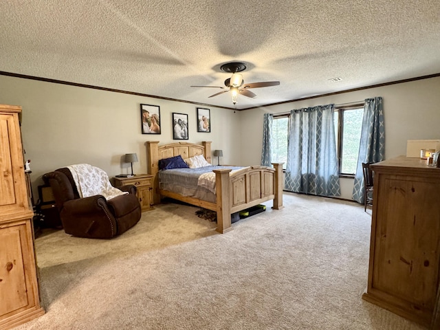 bedroom featuring ornamental molding, light carpet, a textured ceiling, and ceiling fan