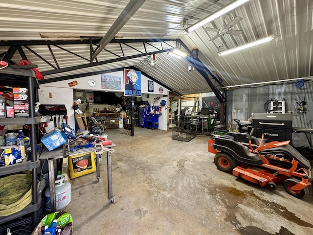 garage featuring a workshop area and metal wall