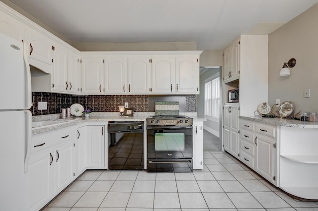 kitchen with white cabinetry, tasteful backsplash, open shelves, light tile patterned floors, and black appliances
