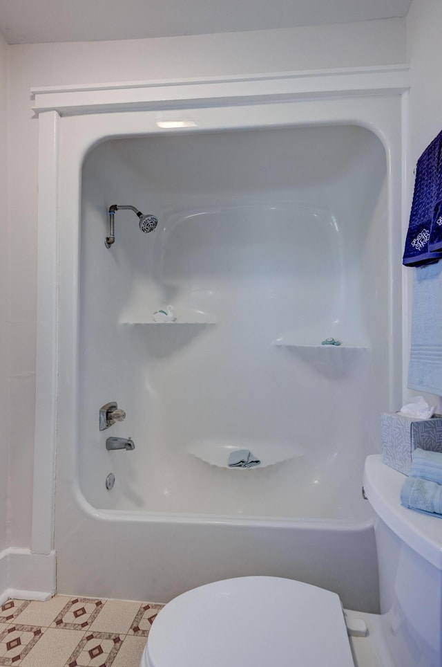 bathroom with toilet and shower / washtub combination