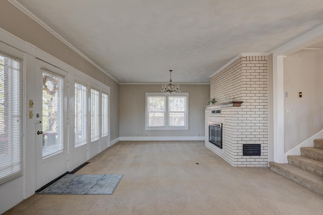 unfurnished living room with crown molding, stairway, a chandelier, light carpet, and a brick fireplace