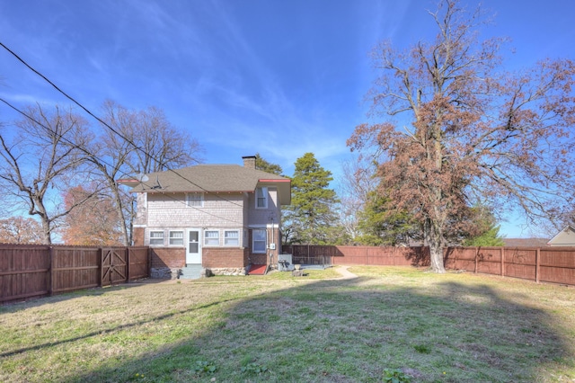 view of yard featuring a fenced backyard and entry steps
