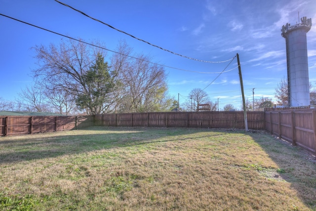 view of yard featuring a fenced backyard