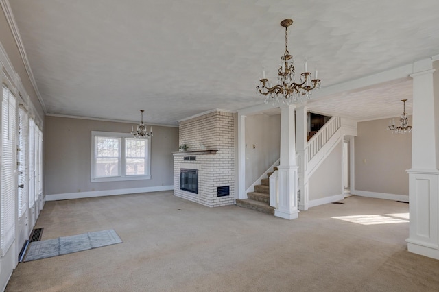 unfurnished living room featuring a notable chandelier, carpet, a fireplace, and crown molding