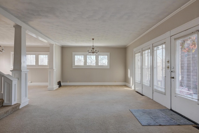 entryway featuring an inviting chandelier, stairway, crown molding, and light carpet