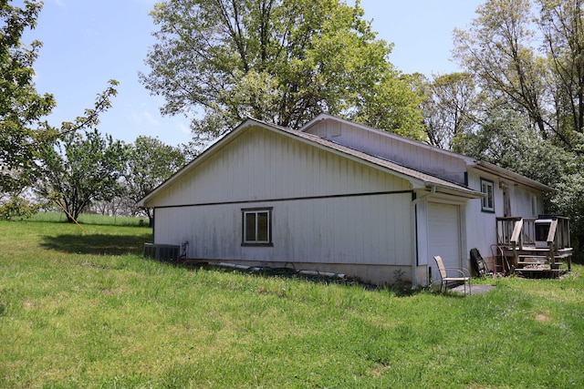 3987 County Road 2350, Pomona, MO 65789 - view of home's exterior featuring a garage, central AC unit, and a lawn
