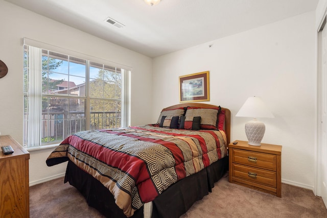 34 Golf Shrs Unit 26, Branson, MO 65616 - bedroom featuring multiple windows, visible vents, baseboards, and carpet
