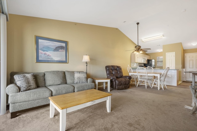 34 Golf Shrs Unit 26, Branson, MO 65616 - living area featuring lofted ceiling, ceiling fan, and light colored carpet
