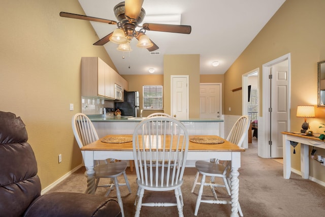 34 Golf Shrs Unit 26, Branson, MO 65616 - dining space featuring a ceiling fan, lofted ceiling, and light colored carpet