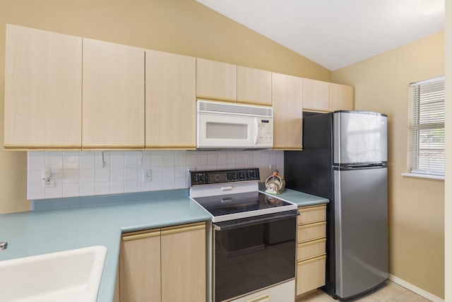 34 Golf Shrs Unit 26, Branson, MO 65616 - kitchen featuring a sink, freestanding refrigerator, light brown cabinetry, range with electric stovetop, and white microwave