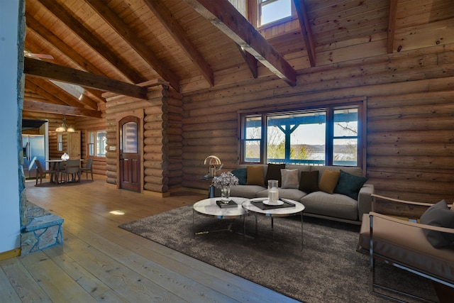 living area with an inviting chandelier, high vaulted ceiling, wooden ceiling, and hardwood / wood-style flooring
