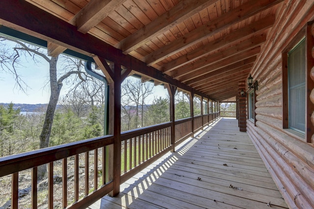 wooden terrace with a view of trees