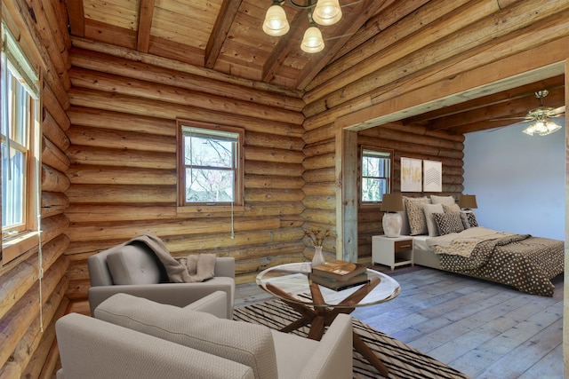 bedroom with hardwood / wood-style floors, vaulted ceiling with beams, multiple windows, and wooden ceiling