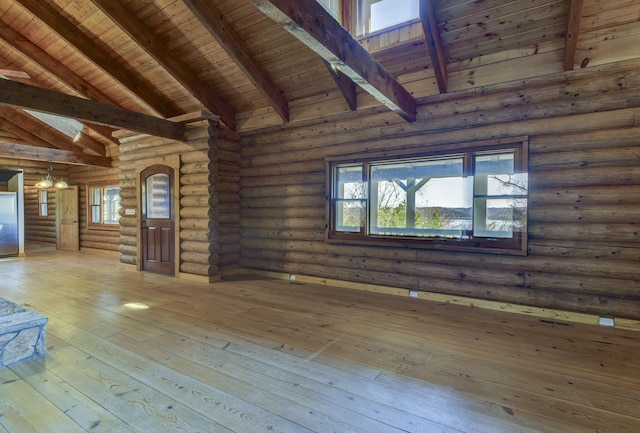 interior space featuring high vaulted ceiling, beamed ceiling, rustic walls, wood ceiling, and wood-type flooring