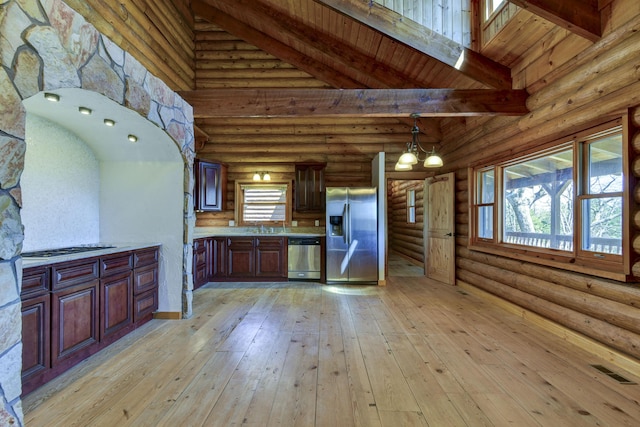 kitchen with light countertops, high vaulted ceiling, beam ceiling, visible vents, and appliances with stainless steel finishes