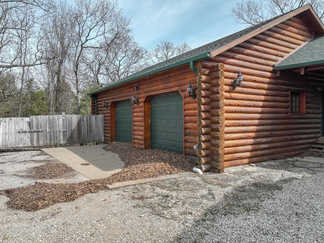 garage with fence