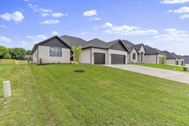 2117 N Silver Charm Ave, Springfield, MO 65802 - view of front of house featuring a garage and driveway