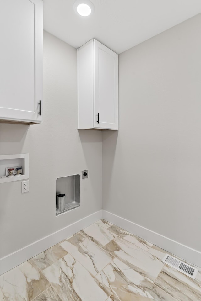 2117 N Silver Charm Ave, Springfield, MO 65802 - washroom with cabinet space, hookup for an electric dryer, hookup for a washing machine, and marble look tiles