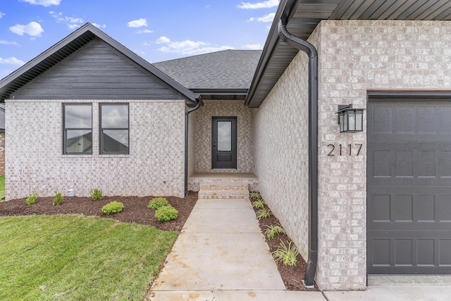 2117 N Silver Charm Ave, Springfield, MO 65802 - entrance to property featuring a garage and a shingled roof