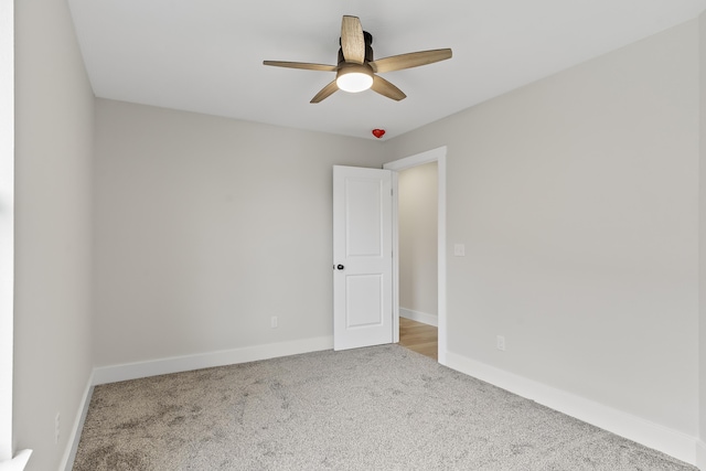 2117 N Silver Charm Ave, Springfield, MO 65802 - carpeted spare room with a ceiling fan and baseboards