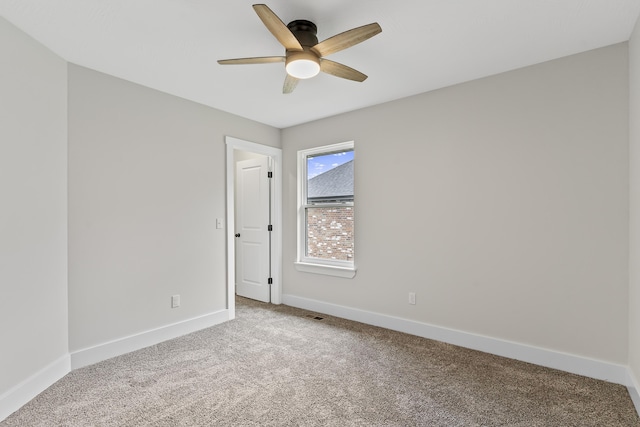 2117 N Silver Charm Ave, Springfield, MO 65802 - carpeted spare room featuring a ceiling fan and baseboards