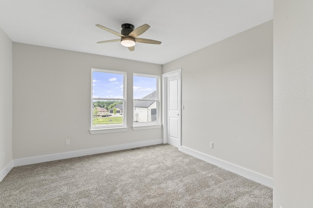 2117 N Silver Charm Ave, Springfield, MO 65802 - carpeted spare room with a ceiling fan and baseboards