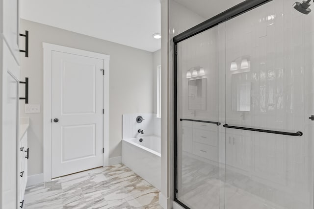 2117 N Silver Charm Ave, Springfield, MO 65802 - bathroom with a garden tub, a stall shower, vanity, and marble finish floors