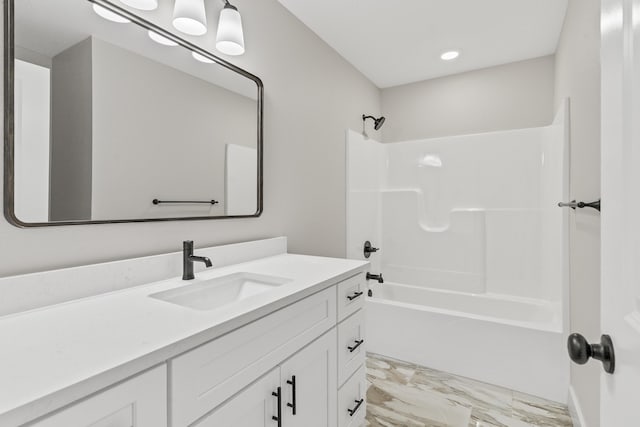 2117 N Silver Charm Ave, Springfield, MO 65802 - full bath featuring marble look tile flooring, vanity, shower / bathtub combination, and recessed lighting