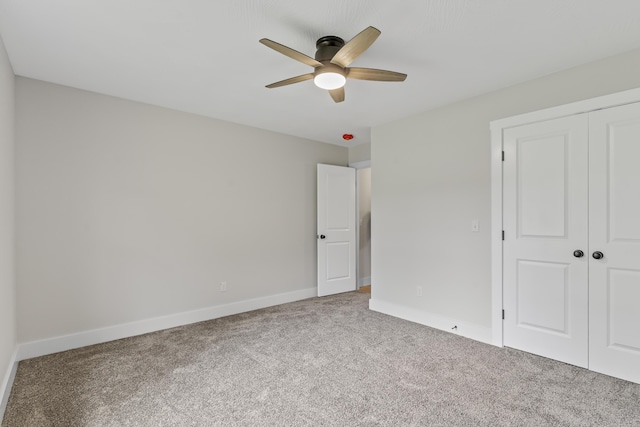 2117 N Silver Charm Ave, Springfield, MO 65802 - unfurnished bedroom with carpet flooring, a closet, and a ceiling fan