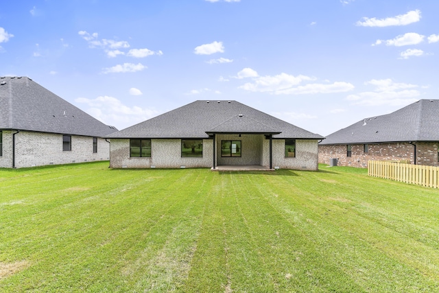 2117 N Silver Charm Ave, Springfield, MO 65802 - rear view of property featuring a patio, brick siding, and roof with shingles