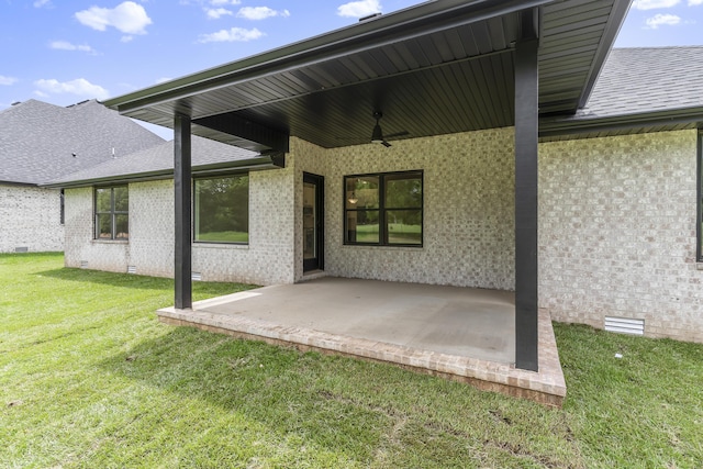 2117 N Silver Charm Ave, Springfield, MO 65802 - rear view of property with crawl space, a patio, a lawn, and a shingled roof