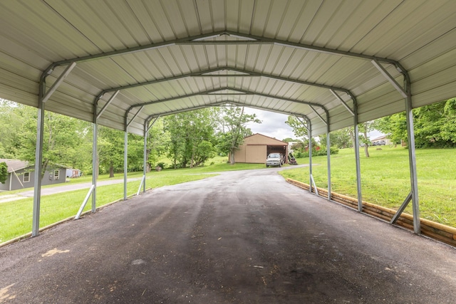 819 E Washington Ave, Ava, MO 65608 - view of parking / parking lot featuring a carport
