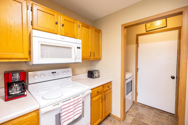 919 S Central Ave, Marionville, MO 65705 - kitchen featuring light countertops, washer / dryer, and white appliances