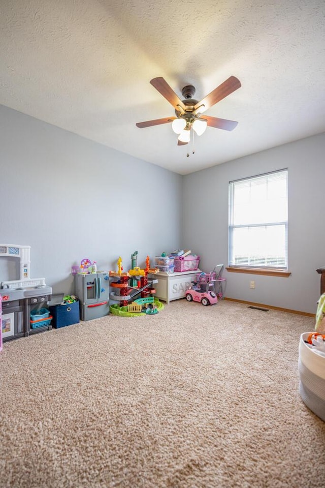919 S Central Ave, Marionville, MO 65705 - recreation room featuring a textured ceiling, ceiling fan, and baseboards