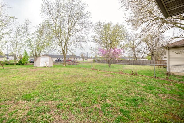 919 S Central Ave, Marionville, MO 65705 - view of yard with an outbuilding, fence, and a storage shed