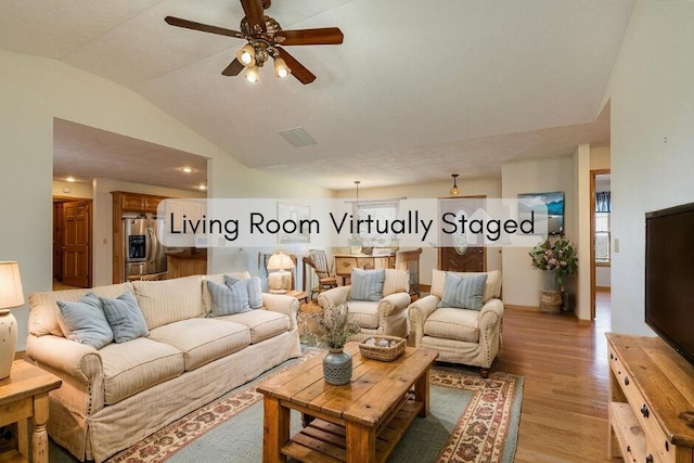 1206 Black Horse Rd, Conway, MO 65632 - living room with lofted ceiling, a ceiling fan, and light wood-type flooring