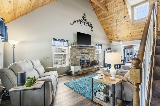 living area featuring baseboards, high vaulted ceiling, wooden ceiling, and a healthy amount of sunlight