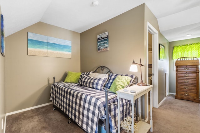 bedroom featuring carpet floors, baseboards, and vaulted ceiling